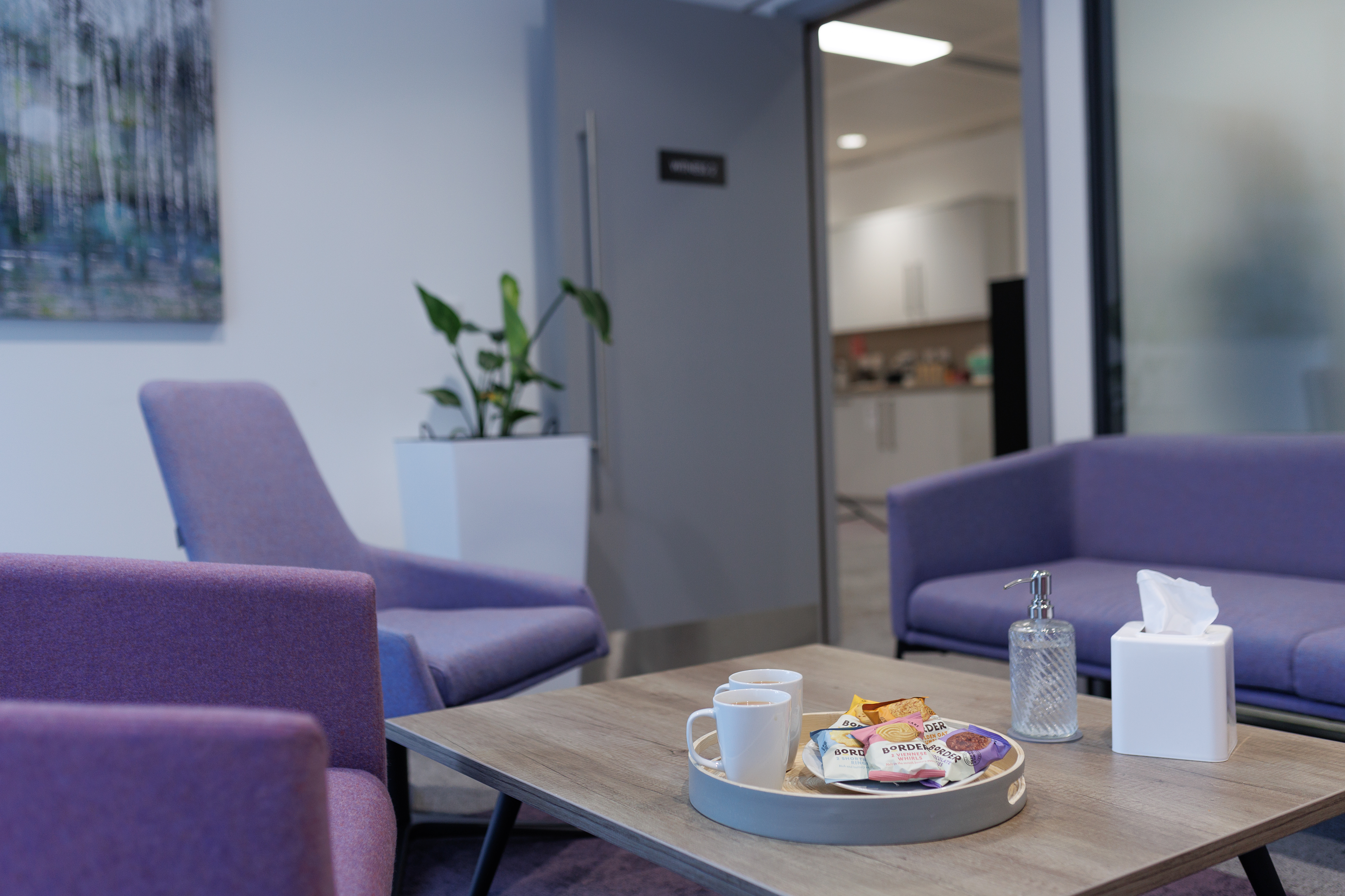 A room with teas and biscuits for talking about experience.